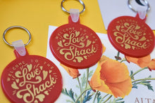 Load image into Gallery viewer, Welcome to the Love Shack Red and Gold Funny Valentine&#39;s Keychain
