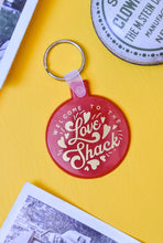 Load image into Gallery viewer, Welcome to the Love Shack Red and Gold Funny Valentine&#39;s Keychain
