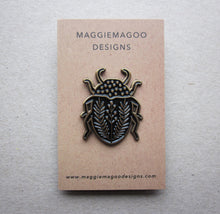 Load image into Gallery viewer, Enamel pin brooch, beetle design, black and gold metal
